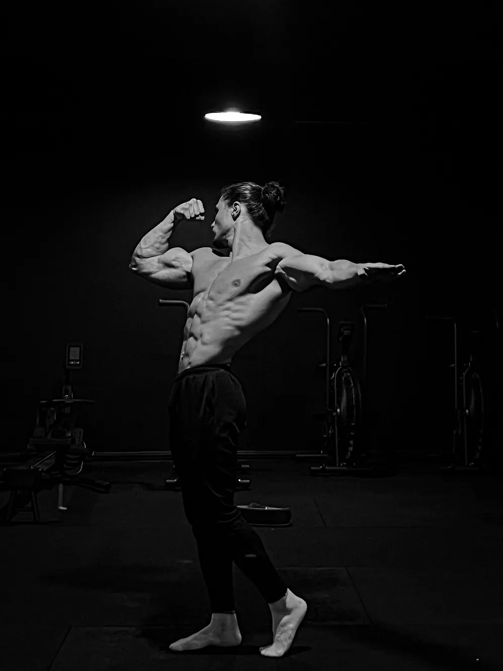 Rachid practising a front pose in the gym