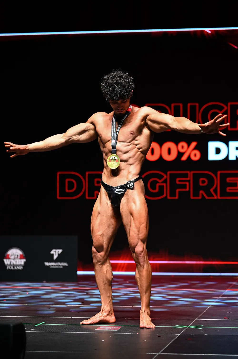 Rachid on stage at a WNBF competition